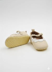 Cream-colored faux leather booties