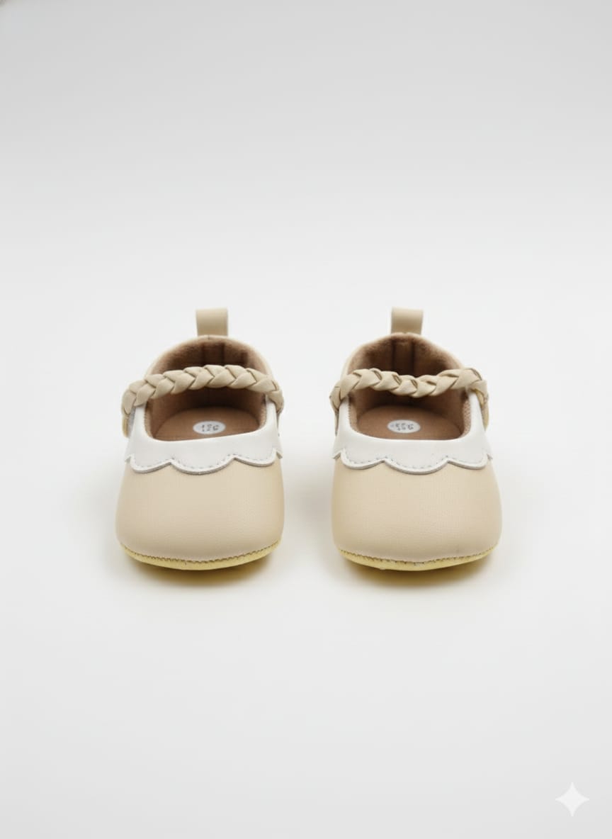 Cream-colored faux leather booties