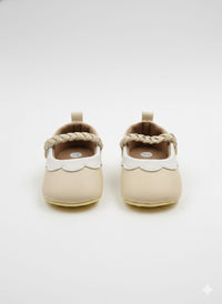 Cream-colored faux leather booties