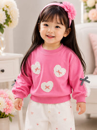 Girls' Heart Patch Pullover Sweatshirt with Ribbon Accents.