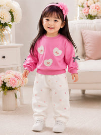Girls' Heart Patch Pullover Sweatshirt with Ribbon Accents.