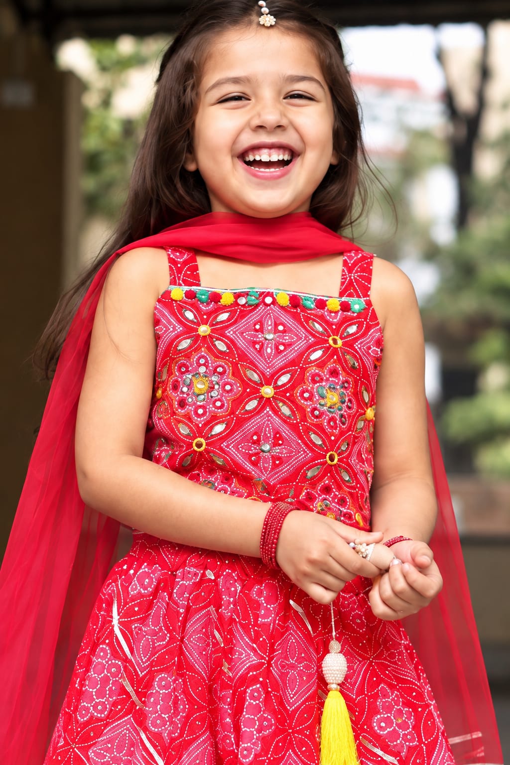 Girls' Red Bandhani Print Mirror-Work Ethnic Lehenga Choli Set.