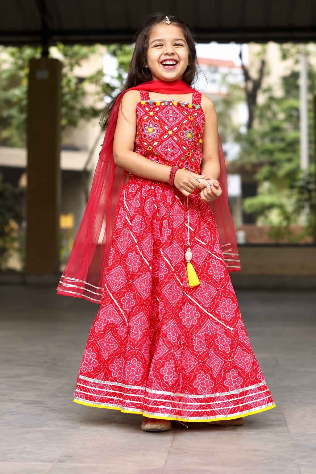 Girls' Red Bandhani Print Mirror-Work Ethnic Lehenga Choli Set.