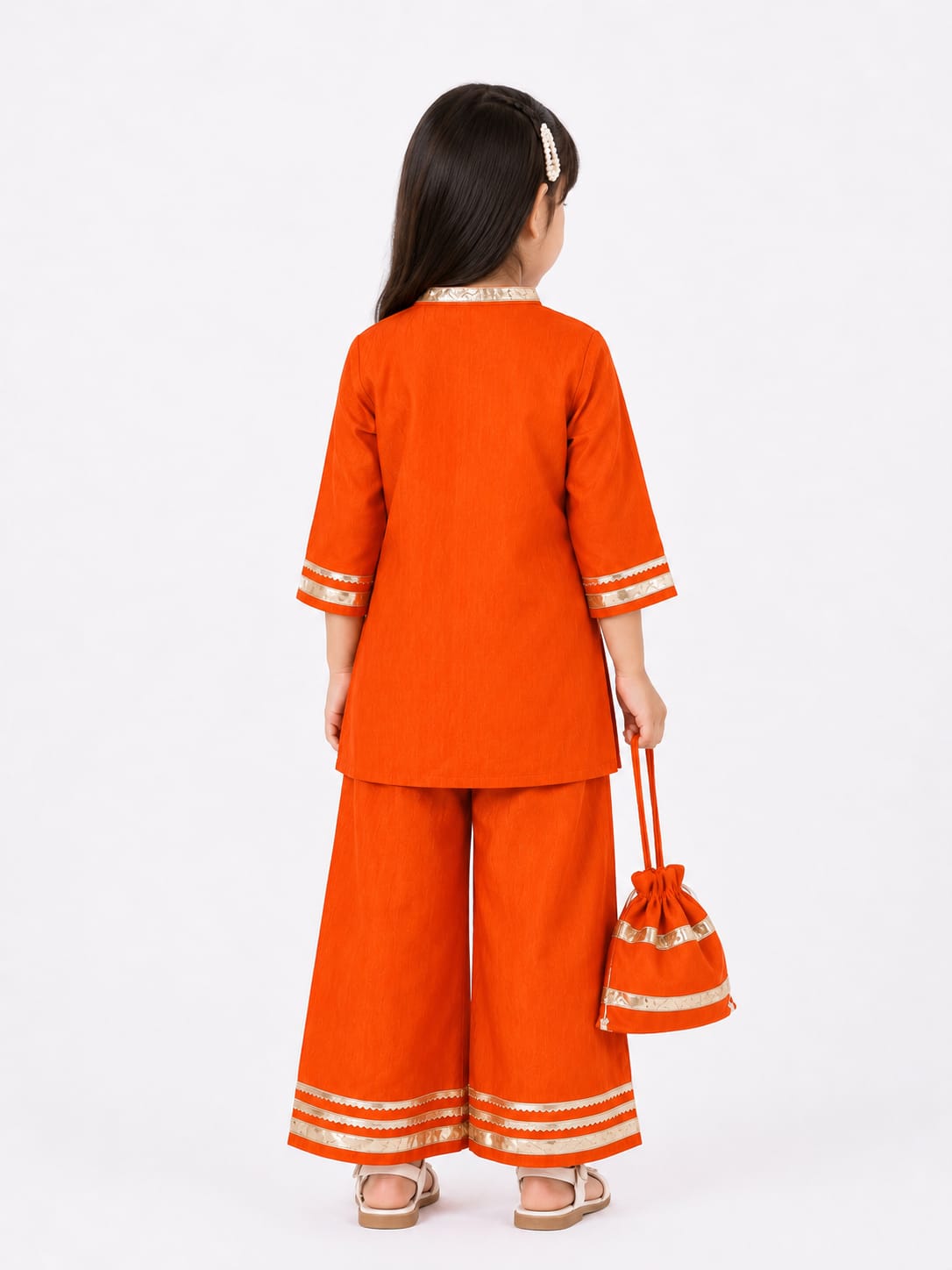 Vibrant Rust-Orange Ethnic Kurta & Bottom Set with Matching Potli.